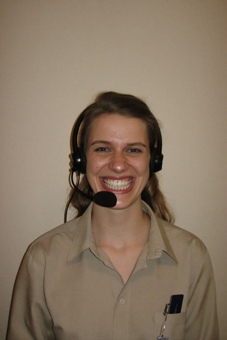 Customer service agent smiling with eyes that are not smiling